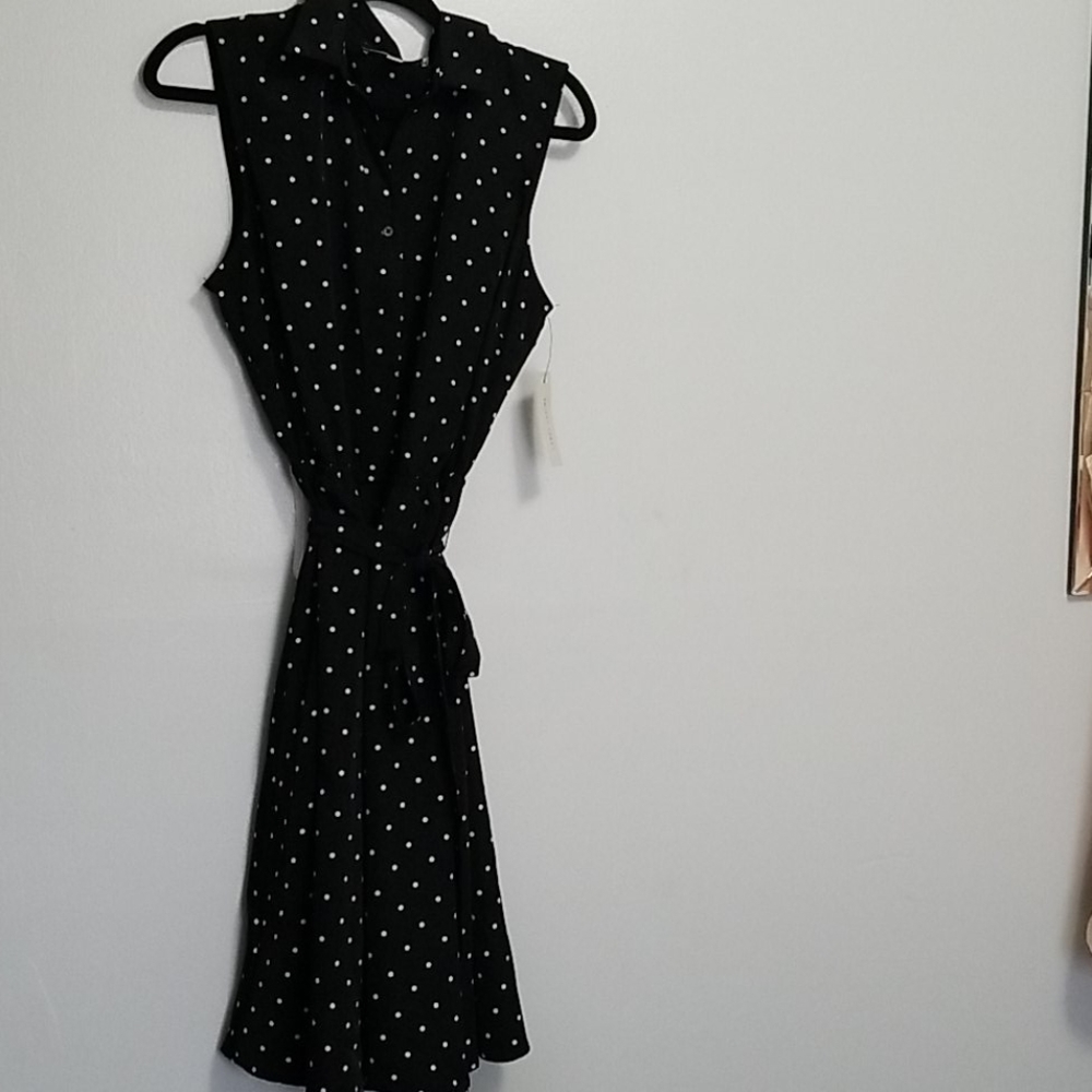 Black and white sleeveless polka dot dress